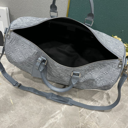 L Grey embossed Backpack or Duffle