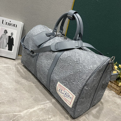 L Grey embossed Backpack or Duffle